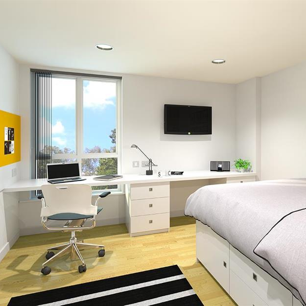 a bedroom with a bed and a desk